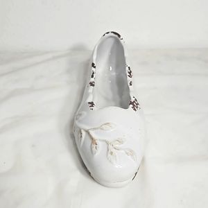 Decorative ceramic ballet shoe vase with vine design